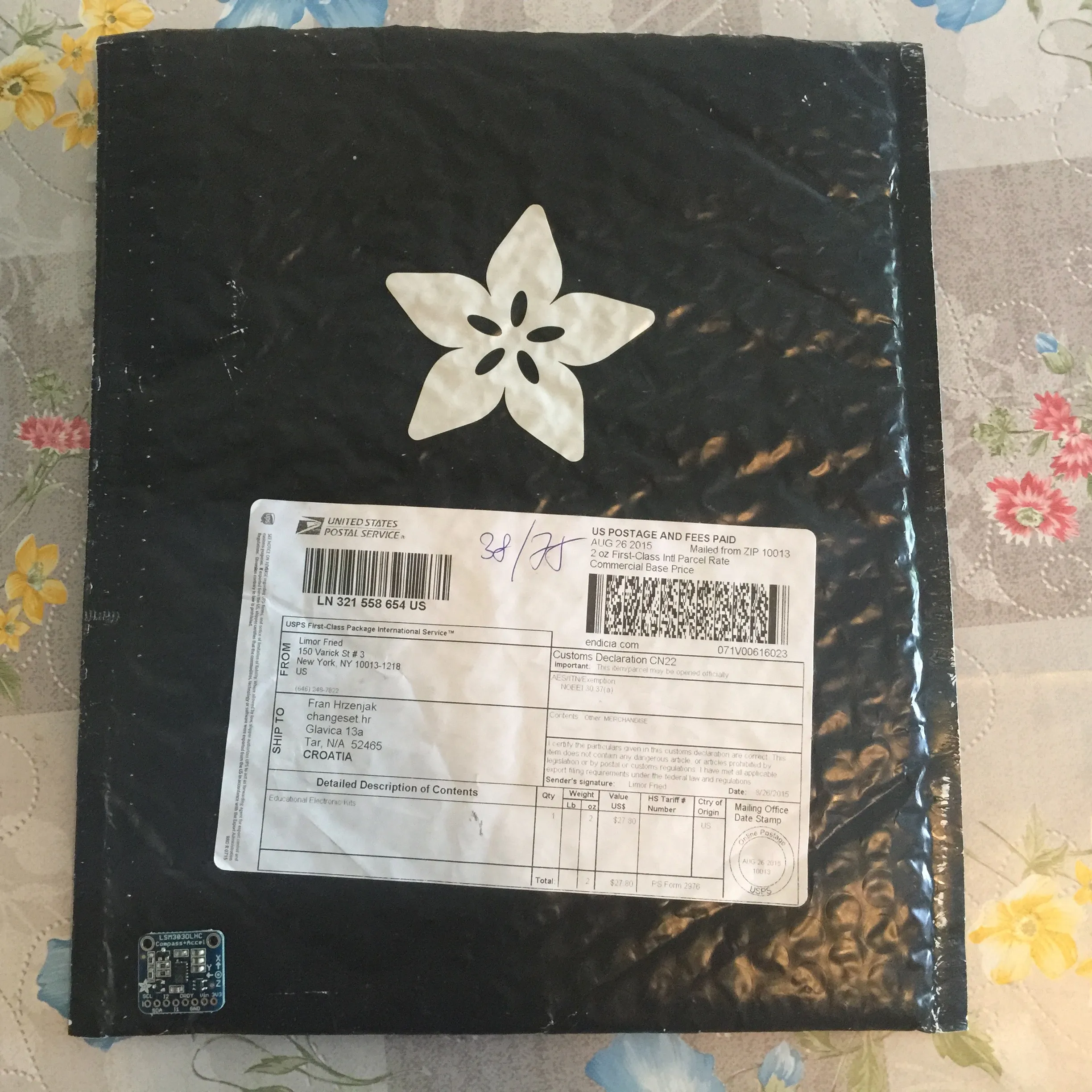 Adafruit can pack their stuff — can you find the device that came in this envelope?