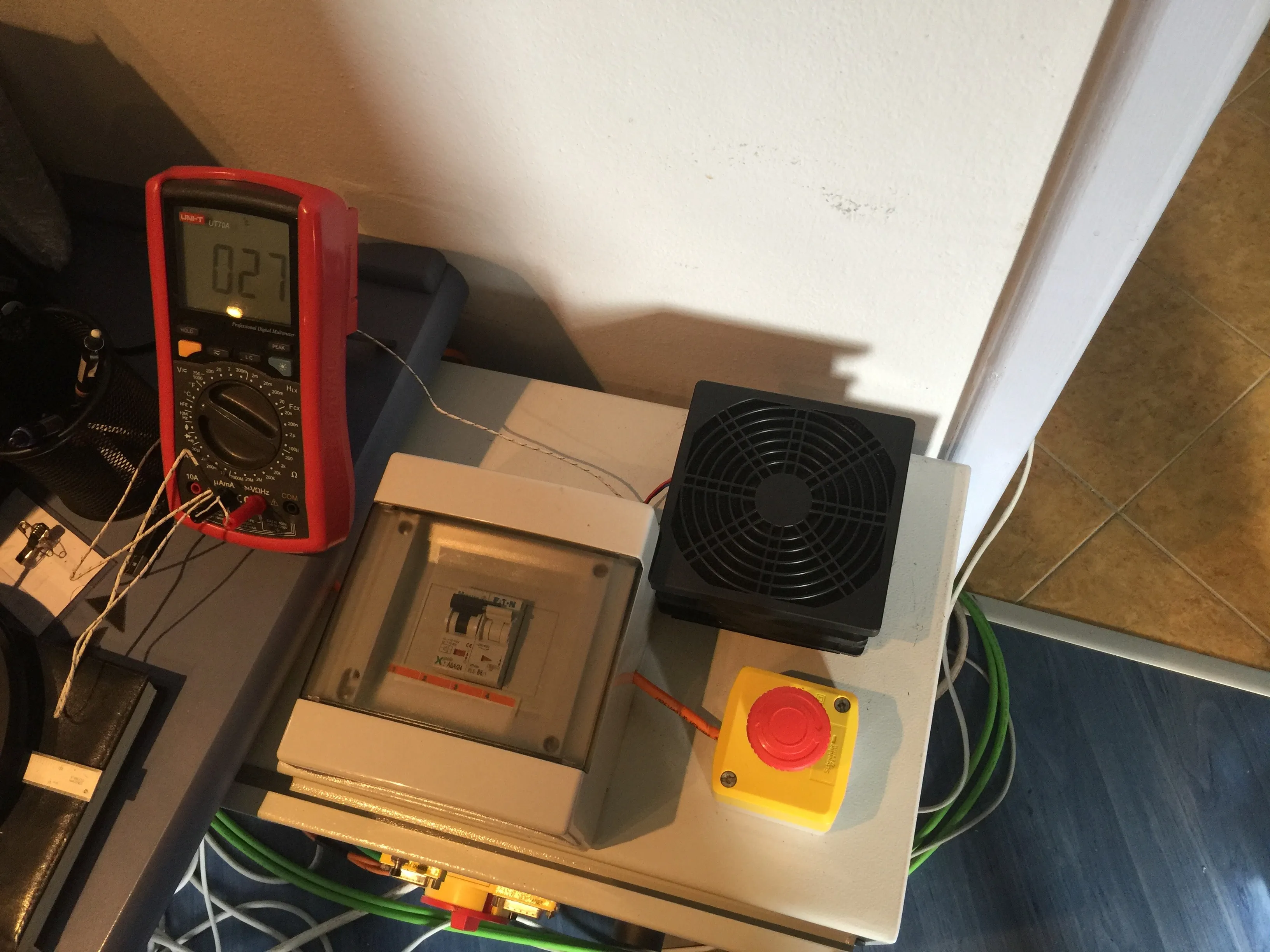 Measuring air temperature inside the enclosure after installing fans