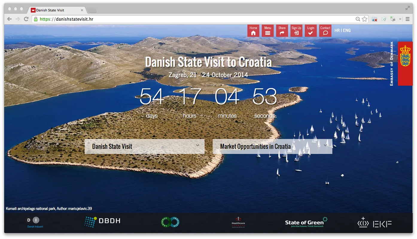 Landing page — "Danish State Visit to Croatia" with a live countdown to the event, set against a wide aerial of the Dalmatian coast, and the partnership bar along the bottom